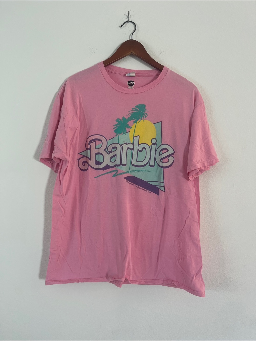 Barbie Pink Tee with Retro Palm and Sunrise Graphic